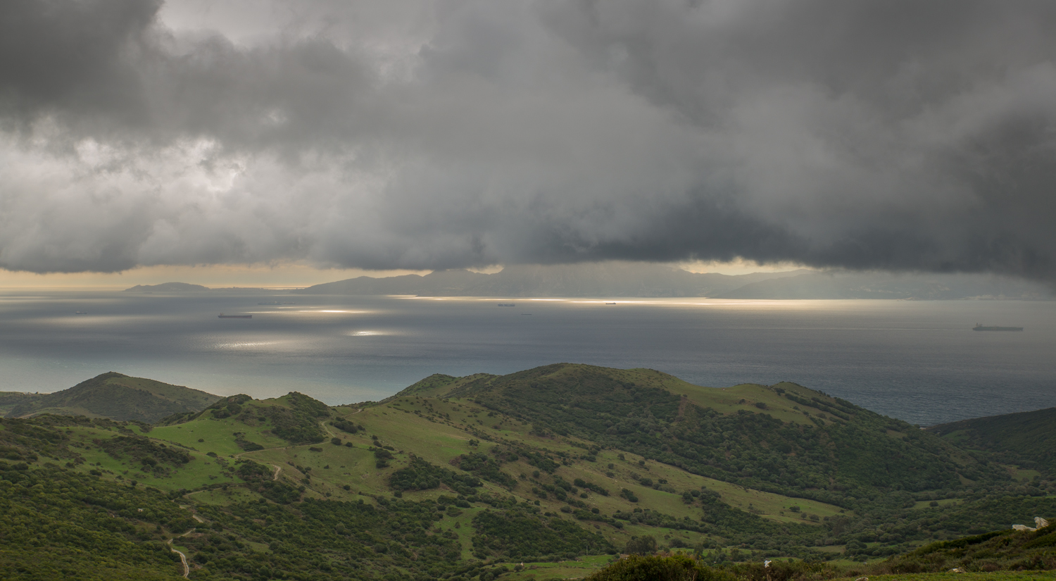 Africa on the horizon, beneath the clouds